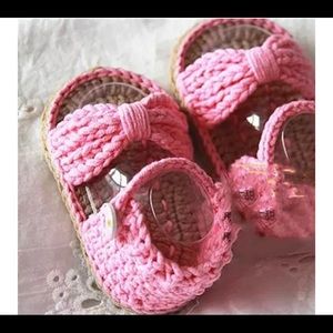 Handmade knitted baby shoes.